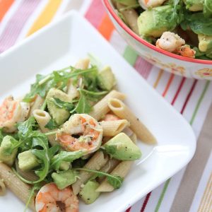 Roasted lemon pepper shrimp tossed with whole wheat pasta, plenty of creamy avocado, arugula, lemon and Parmesan - this Shrimp & Avocado Pasta is a heart-healthy dinner option perfect for any night of the week. Recipe via aggieskitchen.com