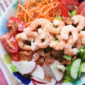 This Garden Salad with Shrimp and Bacon will definitely get you back in the salad! It's is chock full of the best crunchy, colorful veggies plus protein to fill you up and keep you feeling good.