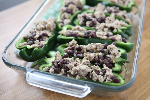 Only 5 ingredients to make these delicious Stuffed Poblano Peppers with Turkey and Black Beans! A light, healthy dinner perfect for weeknights. Leftovers make for great lunches too! Recipe via aggieskitchen.com