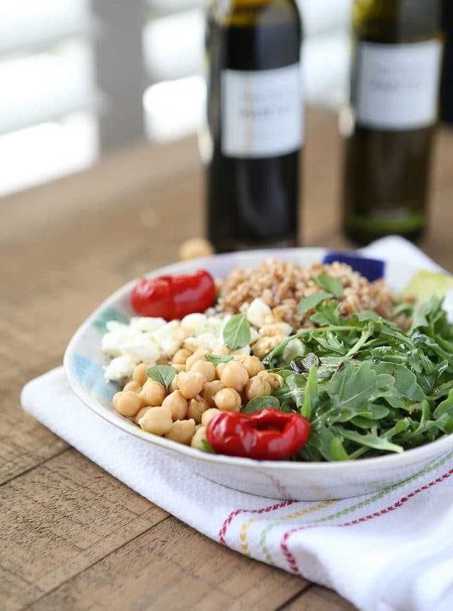 This Mediterranean Farro Salad with Arugula & Chickpeas is a hearty & healthy vegetarian whole grain dish. Great source of protein and fiber! Perfect for Meatless Monday! Recipe via aggieskitchen.com