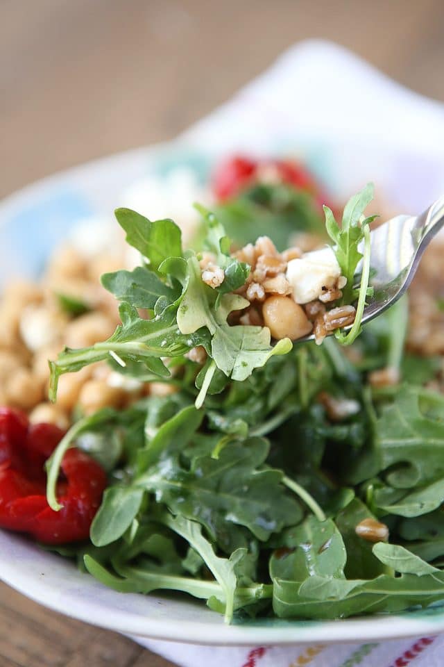 This Mediterranean Farro Salad with Arugula & Chickpeas is a hearty & healthy vegetarian whole grain dish. Great source of protein and fiber! Perfect for Meatless Monday! Recipe via aggieskitchen.com