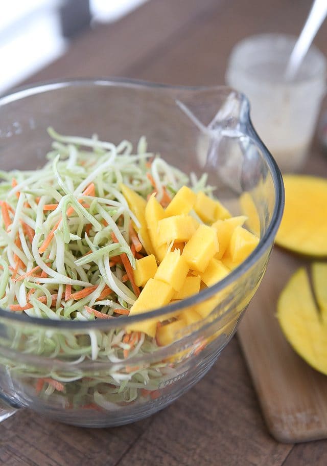 This Tangy Mustard Broccoli Slaw Salad with Mango is the perfect addition to any spring or summer meal! Serve with burgers, chicken or fish. Recipe via aggieskitchen.com