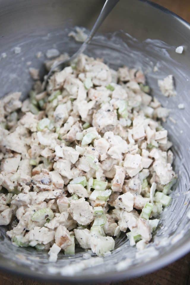 bowl of chicken, sweet onions, celery, seasonings, and mayonnaise mixed together