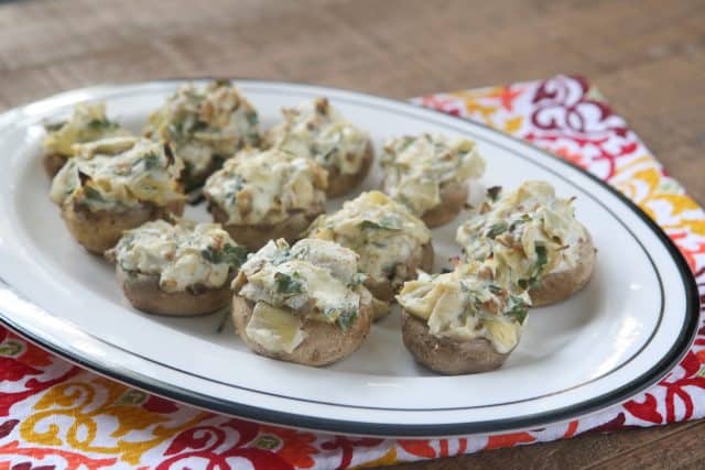 These Artichoke Stuffed Mushrooms have a creamy, cheesy filling and are easy to make - perfect for entertaining! #ad #UndeniablyDairy 