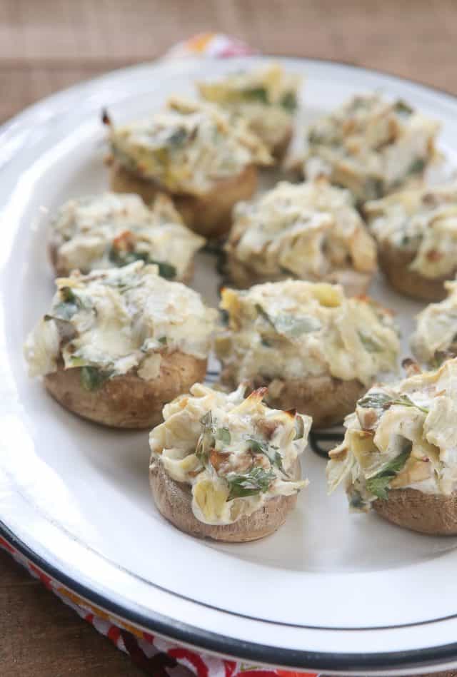 These Artichoke Stuffed Mushrooms have a creamy, cheesy filling and are easy to make - perfect for entertaining! #ad #UndeniablyDairy 