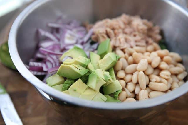 Packed with protein and nutrients your body will thank you for, this Lemony Tuna and White Bean Kale Salad with Avocado is one of my favorite salads. #tuna #kale #salad #avocado #LowCarb