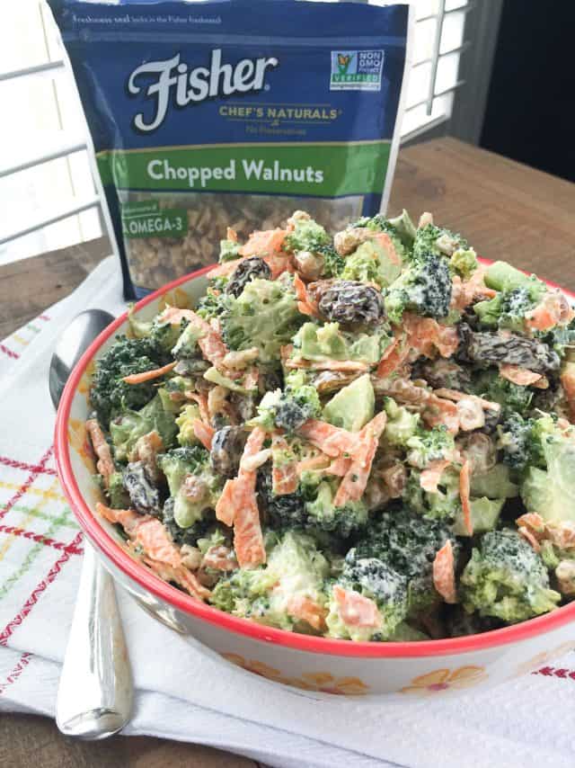 Need a side dish for summer entertaining? I've got you covered with this simple Broccoli and Raisin Salad with Walnuts. #ThinkFisher #broccoli #salad #carrots #salad #walnuts #picnic